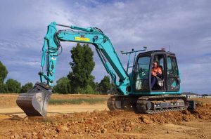 Can long boom excavators be used in construction and agriculture?